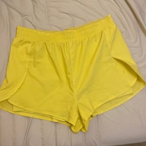 Girlfriend Collective lemon yellow running shorts
